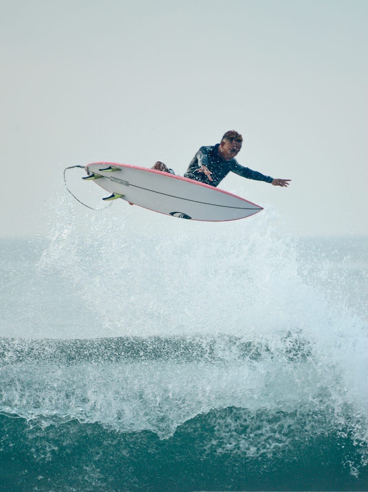 Longboard glides on Sanur reefs